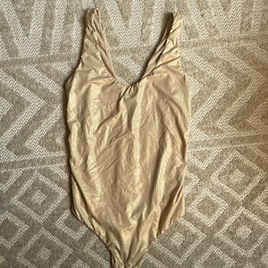 Stance gold body suit